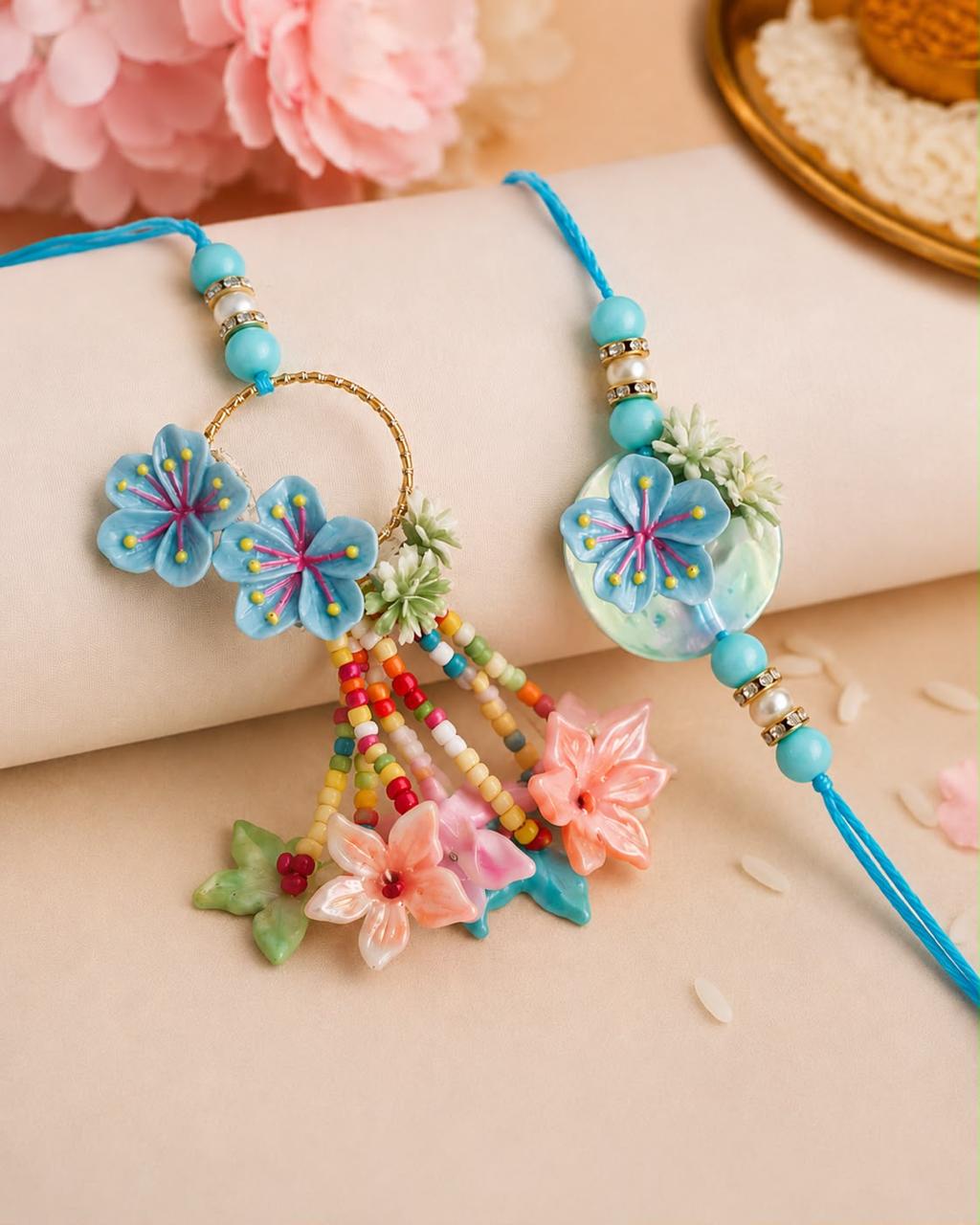 Elegant Sky Blue Floral Bhai Bhabhi Rakhi Set with Designer Lumba